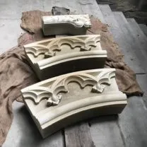 Image showing Newly carved sections of the clock surround ready to go to site